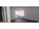 Cozy bedroom featuring wood floors and a window with white blinds at 5796 Par Four Ct, Lithonia, GA 30038