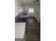 Bright kitchen with marble countertops, hardwood flooring, and modern stainless steel appliances at 5796 Par Four Ct, Lithonia, GA 30038