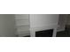 White fireplace with decorative shelving in a modern living room at 5796 Par Four Ct, Lithonia, GA 30038