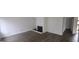 Modern living room with hardwood floors, bright white walls, and a fireplace at 5796 Par Four Ct, Lithonia, GA 30038