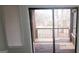 View of a wood patio and nature seen through sliding glass doors at 5796 Par Four Ct, Lithonia, GA 30038