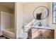 Cozy bathroom featuring a marble countertop vanity and a toilet next to the window at 6192 Holiday Blvd, Forest Park, GA 30297