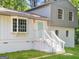 Charming two-story home featuring a bay window, painted brick, and a welcoming light blue front door at 6192 Holiday Blvd, Forest Park, GA 30297