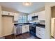Well-lit kitchen with stainless steel appliances, ample counter space, and modern fixtures at 6192 Holiday Blvd, Forest Park, GA 30297