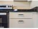 Detail shot highlighting white cabinets, black hardware, and the stainless steel oven at 6192 Holiday Blvd, Forest Park, GA 30297