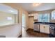 Updated kitchen with stainless steel dishwasher, a bright window, and sleek black countertops at 6192 Holiday Blvd, Forest Park, GA 30297