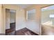 Cozy living area with hardwood floors, neutral paint, and convenient access to the kitchen at 6192 Holiday Blvd, Forest Park, GA 30297