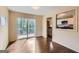 Inviting living room boasts hardwood floors, natural light, and access to the outdoor deck at 6192 Holiday Blvd, Forest Park, GA 30297