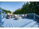 Back deck with seating, a fire pit and mature trees creating a private space at 106 Victoria Way, Carrollton, GA 30116