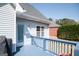 Back deck view featuring blue railing, siding, and a view of the backyard at 106 Victoria Way, Carrollton, GA 30116