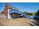View of the home's backyard with a blue deck and a grassy yard at 106 Victoria Way, Carrollton, GA 30116