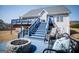 Picture of the backyard with blue deck, stairs, fire pit, and outdoor seating at 106 Victoria Way, Carrollton, GA 30116