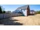 Large backyard view with a wooden fence, mature trees, and a two-level deck at 106 Victoria Way, Carrollton, GA 30116