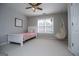 Bright bedroom features a hanging chair and a large window that provides great natural light at 106 Victoria Way, Carrollton, GA 30116