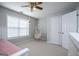 Bright bedroom features a hanging chair and a large window that provides great natural light at 106 Victoria Way, Carrollton, GA 30116