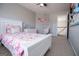 Comfortable bedroom with a vibrant butterfly theme and a hanging chair at 106 Victoria Way, Carrollton, GA 30116
