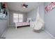 Comfortable bedroom with a vibrant butterfly theme and a hanging chair at 106 Victoria Way, Carrollton, GA 30116