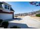 Long driveway leading to a two-car garage in a residential neighborhood at 106 Victoria Way, Carrollton, GA 30116