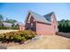 Brick exterior of charming home with manicured landscaping and a well-maintained lawn at 106 Victoria Way, Carrollton, GA 30116