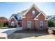 Charming brick home with gray shutters and a well-maintained lawn at 106 Victoria Way, Carrollton, GA 30116