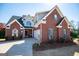 Beautiful brick home with a well-manicured lawn and a welcoming front porch at 106 Victoria Way, Carrollton, GA 30116