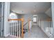 View of the second floor hallway with carpet and white railings at 106 Victoria Way, Carrollton, GA 30116