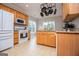 Spacious kitchen with stainless steel appliances, wood cabinets, and granite countertops at 106 Victoria Way, Carrollton, GA 30116