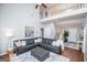 Comfortable living area with a plush sofa, neutral decor, high ceilings, and great natural light at 106 Victoria Way, Carrollton, GA 30116