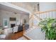 Inviting living room with a marble fireplace, hardwood floors and staircase at 106 Victoria Way, Carrollton, GA 30116