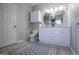 This main bathroom features a double sink vanity and a tiled floor at 106 Victoria Way, Carrollton, GA 30116