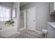 This main bathroom features a soaking tub and a tiled floor at 106 Victoria Way, Carrollton, GA 30116