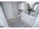 Well-lit main bathroom features a double sink vanity and a tiled floor at 106 Victoria Way, Carrollton, GA 30116