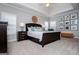 This main bedroom offers a tray ceiling, neutral paint, and carpeted flooring at 106 Victoria Way, Carrollton, GA 30116