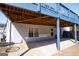 Covered outdoor patio provides shade and a view of the green yard and swing at 106 Victoria Way, Carrollton, GA 30116
