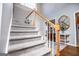 A carpeted staircase ascends to the home's upper level at 106 Victoria Way, Carrollton, GA 30116