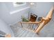 View of the carpeted staircase with wood railing from the second floor of the home at 106 Victoria Way, Carrollton, GA 30116