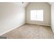 Well-lit bedroom with soft carpeting and a window providing natural light at 139 Surge Stone Ln, Stockbridge, GA 30281