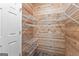 Walk-in closet includes wood paneling and multiple wire shelves for ample storage at 679 Bo Bo Banks Rd, Grantville, GA 30220