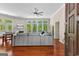 Spacious living room offers hardwood floors, a modern fan, and natural light with views of the yard at 679 Bo Bo Banks Rd, Grantville, GA 30220