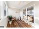 Bright sunroom featuring natural light, a ceiling fan, wood flooring, and a neutral color palette at 679 Bo Bo Banks Rd, Grantville, GA 30220