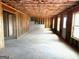 Unfinished basement with exposed framing and ample natural light at 413 Samara Ct, Fairburn, GA 30213