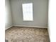 Cozy bedroom with plush carpet and a bright window for natural light at 413 Samara Ct, Fairburn, GA 30213