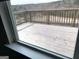 View of wooden deck with wood railing overlooking the mountains at 413 Samara Ct, Fairburn, GA 30213