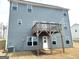 Rear exterior of a two-story home with a raised deck at 413 Samara Ct, Fairburn, GA 30213
