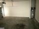Spacious garage with concrete floors and water heater at 413 Samara Ct, Fairburn, GA 30213