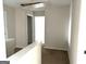 View of carpeted hallway and access to attic at 413 Samara Ct, Fairburn, GA 30213