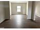 Bright living room featuring hardwood floors and natural light from window at 413 Samara Ct, Fairburn, GA 30213
