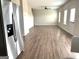 Spacious living room with stainless steel appliances in background at 413 Samara Ct, Fairburn, GA 30213