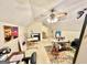Large attic room with several paintings and a ceiling fan at 170 White Rd, Fayetteville, GA 30214