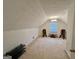 Attic space with carpet, window, and furniture at 170 White Rd, Fayetteville, GA 30214